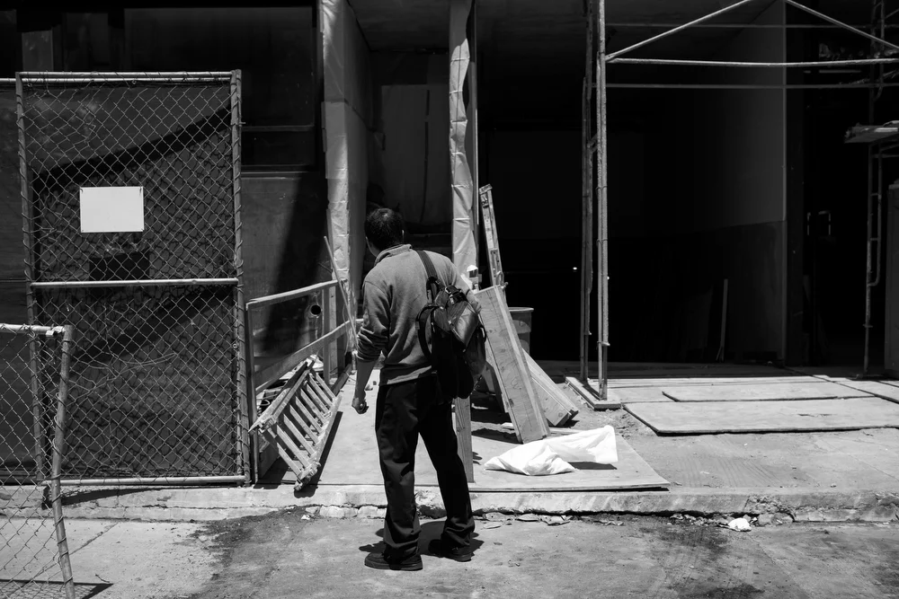 With an affordable housing application in hand, Jerry Chong Liangguo looks at the 400 Grove Street apartment complex in San Francisco, Calif. on June 2, 2015. Liangguo was told to fill out the application and take it to the apartment complex in order to put his family into a lottery for a chance at moving into one of a handful of affordable apartments in the building. However, when he arrived at the address to apply, the apartment building was completely under construction. When he realized that his family could not live here, he said, "I cannot believe this! How can this be?" He could not find anywhere to take the application. There were unfinished walls on the building, so it was clear to him that the apartment building would not be an option for a long time. When he called the apartment office, he could not understand what the automated menu options were, because he is still learning English. He explained that his family currently lives in a very small apartment in the Mission. He said that it smelled of mold and had rats, which makes him concerned for his son's health. "I immigrated here for a better life," Liangguo, who is an engineering director who immigrated with his family from China, said. "If I want to continue living here, it is so expensive. I am going to have to move soon." 