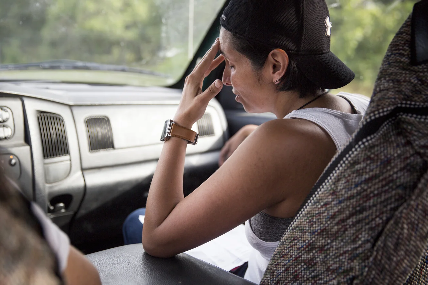  Glenda Bamberger rubs her forehead while she looks at a receipt for the sand and rocks needed to make the cement for the pillars that will hold up their new house in Blanco, Texas, U.S. on July 11, 2015.  The Bambergers' new house needs to be raised