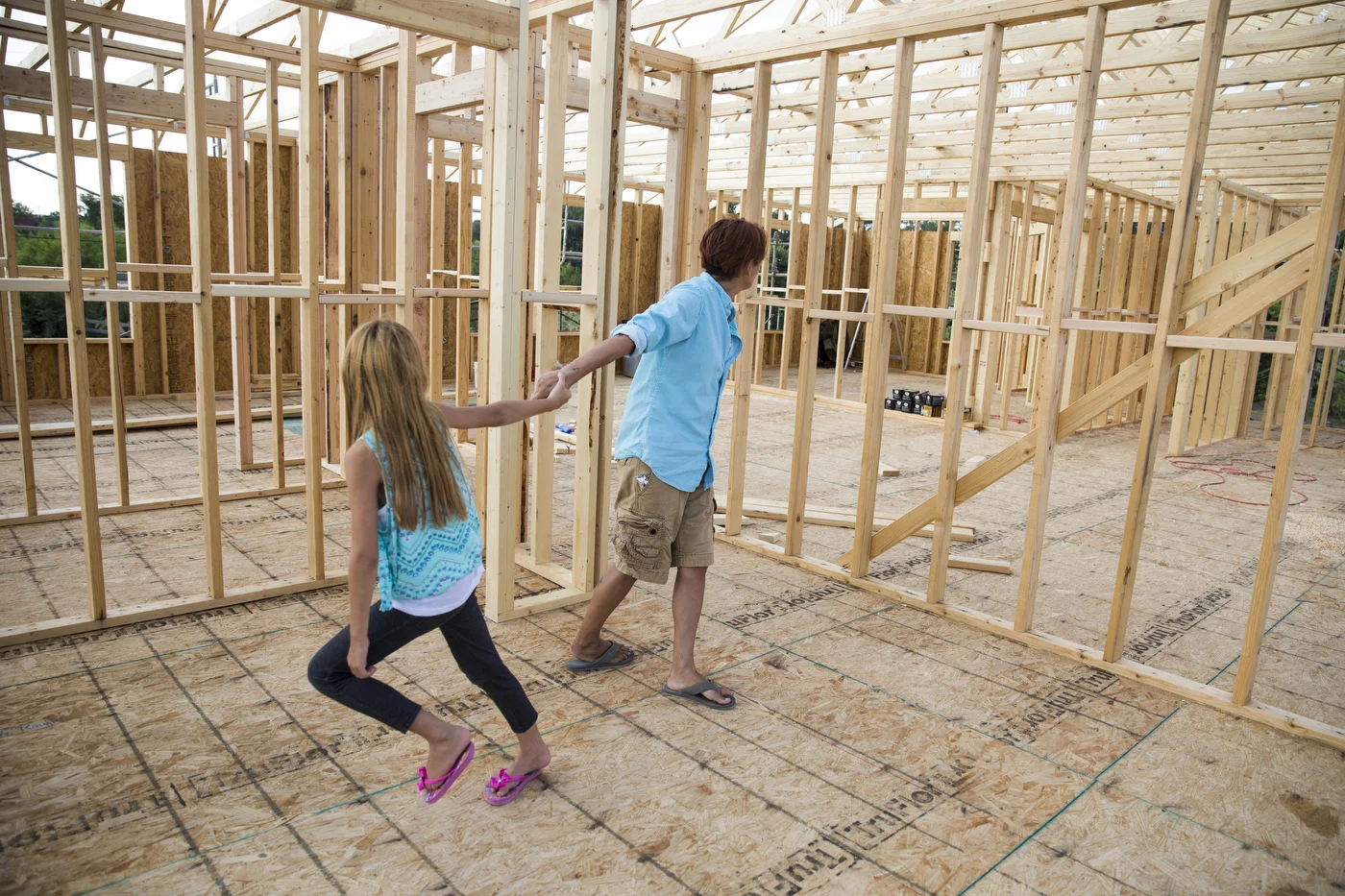  Glenda Bamberger and her daughter Cielo Bamberger spin around in what will eventually be Cielo's bedroom in their new house in Blanco, Texas, U.S. on August 22, 2015.  After receiving donations from several flood and disaster relief organizations fr