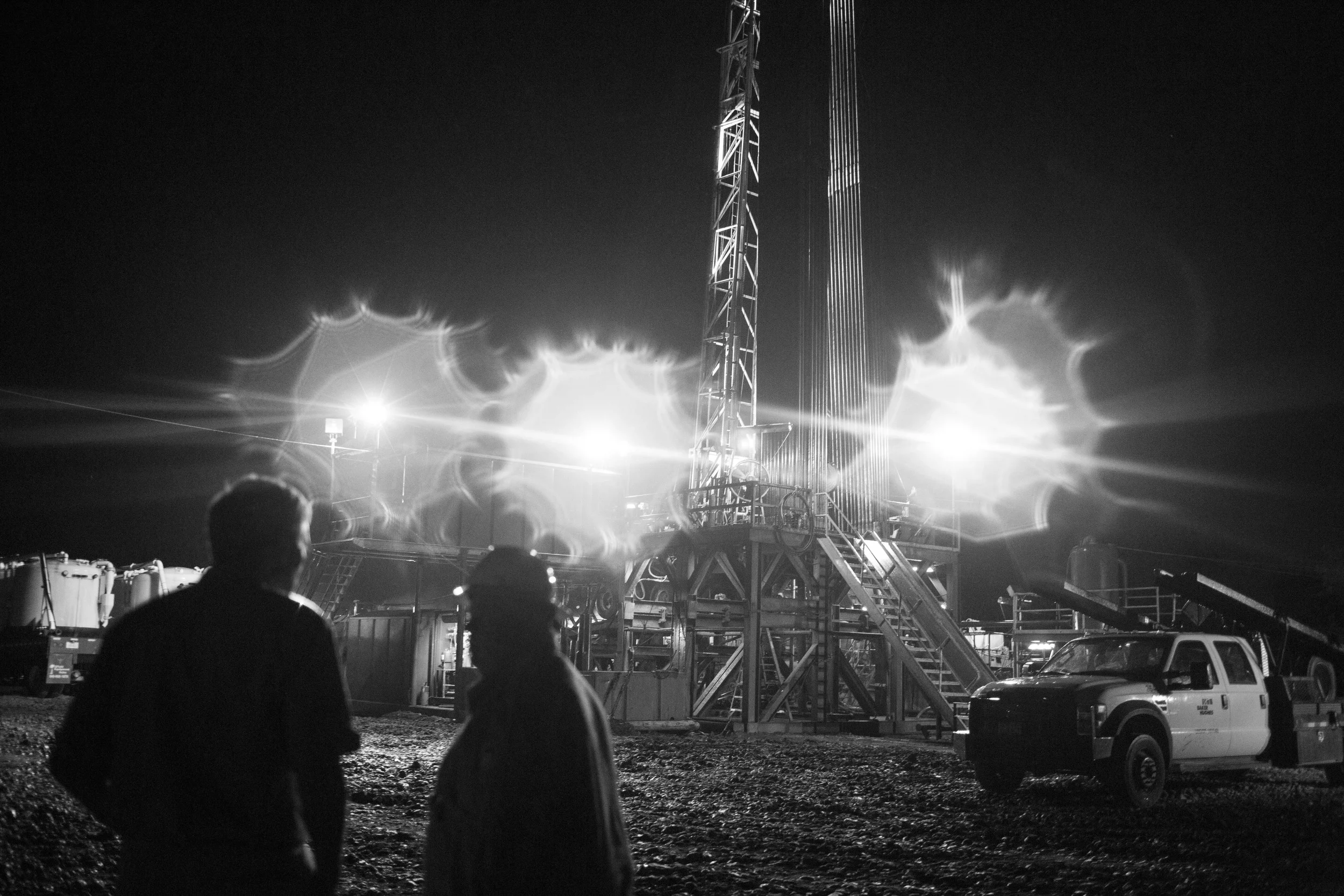  Contract operator Hans Helland and company man Nolan Sheedy talk by an oil rig in Hallettsville, Texas on May 22, 2015. The steep drop in oil prices has forced oil companies to cancel drilling contracts throughout the Eagle Ford Shale region. 