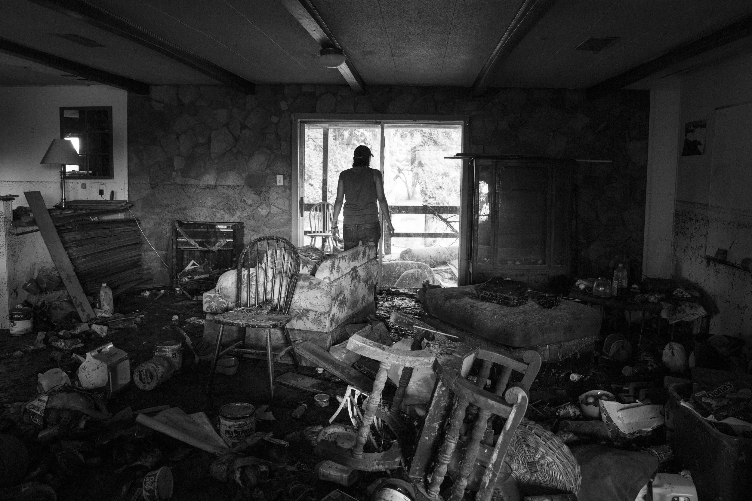  Glenda Bamberger looks out of the back door of her home in Blanco, Texas, U.S. on Friday, May 29, 2015 after flash floods destroyed her home, her husband's business and most of her family's belongings. Bamberger, who was born and raised in Blanco, s