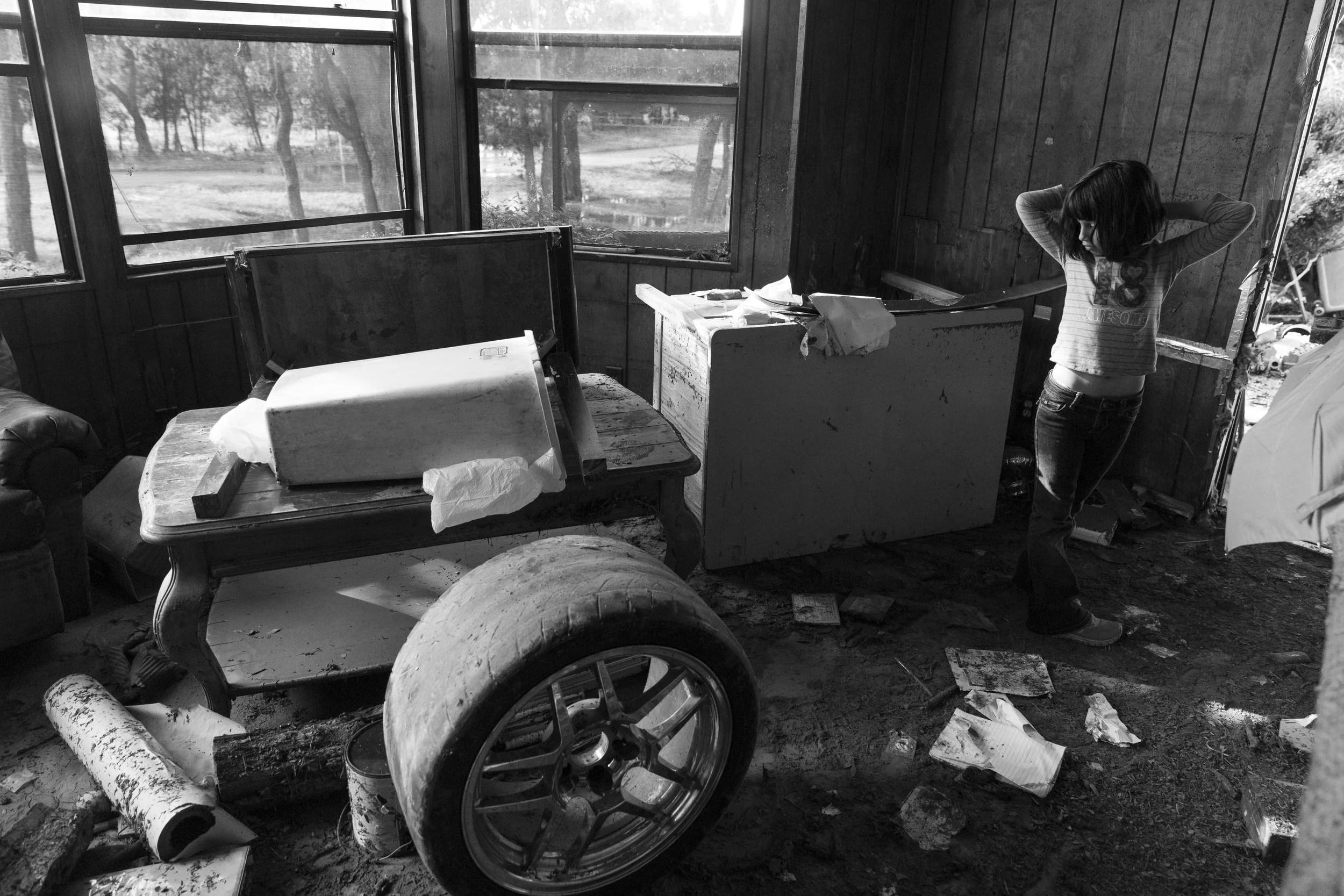  Serenity Bamberger, 7, looks at the damage in her home in Blanco, Texas on Friday, May 29, 2015. Of the donations that have flooded in to help Serenity and her family, she said, "It is like Christmas." However, her mother Glenda Bamberger said that 