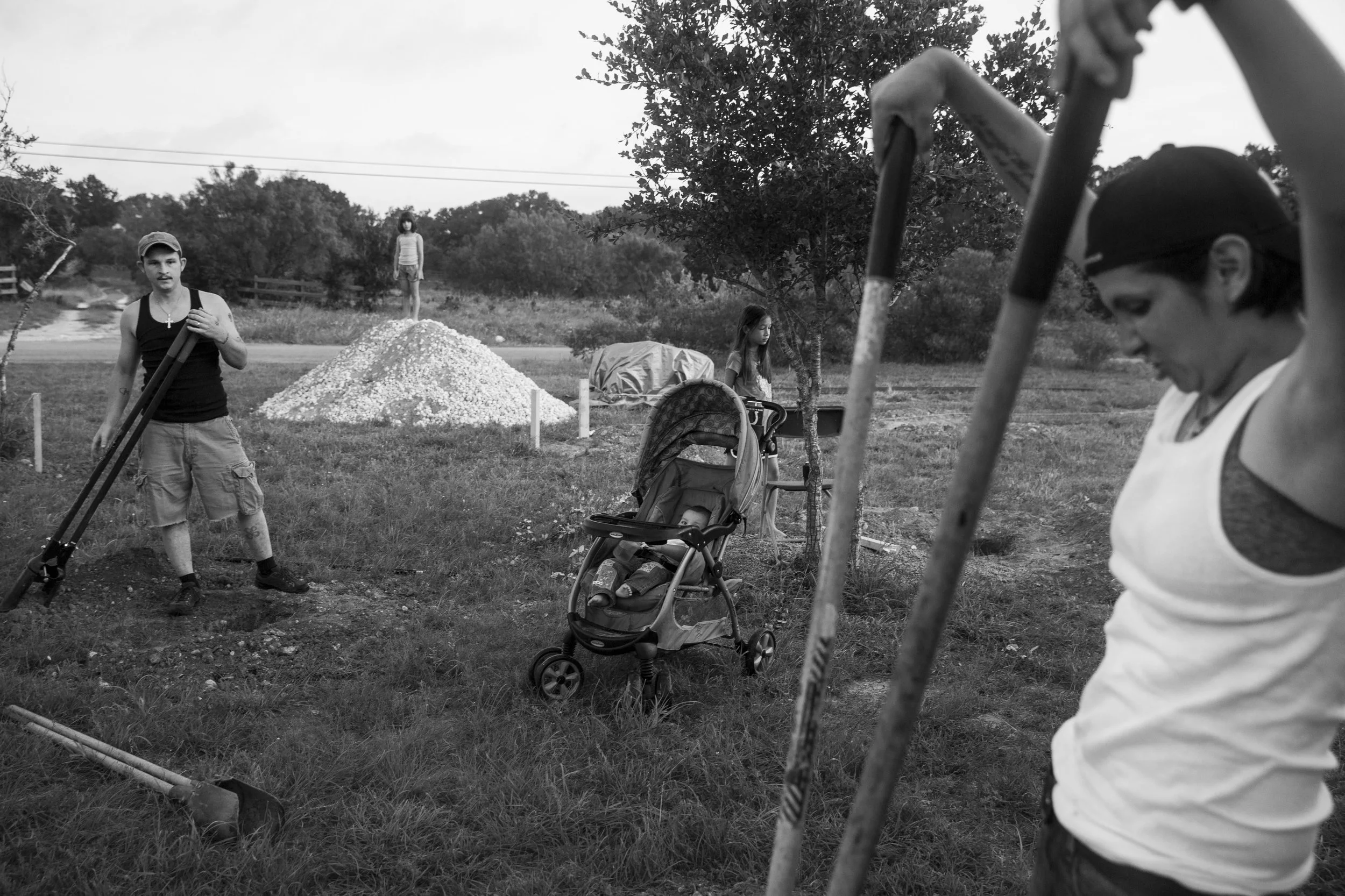  Glenda Bamberger, right, and her husband Jarrell Bamberger, left, widen holes dug in their yard in Blanco, Texas, U.S. on July 11, 2015. Their home was destroyed in the floods that occurred in May along the Blanco River in Central Texas. They poured