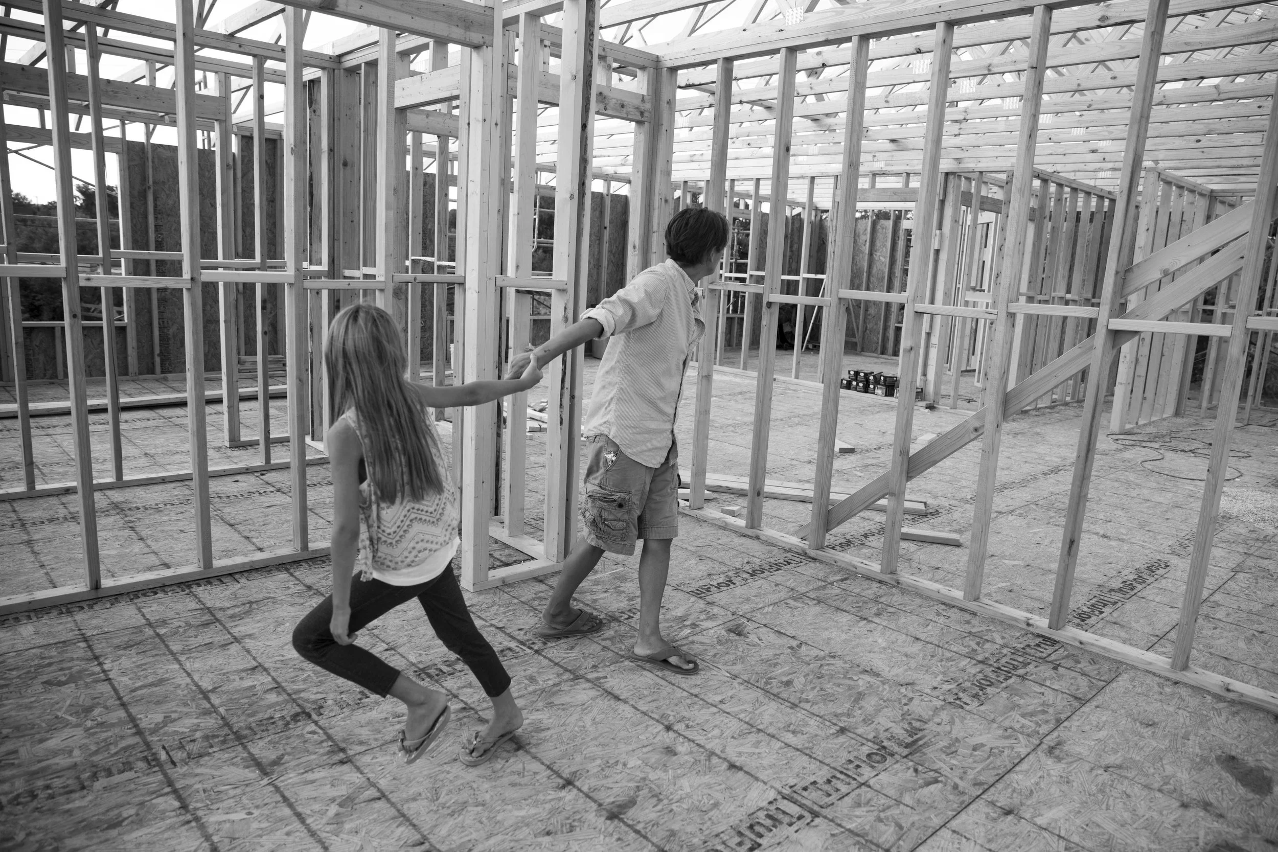 Glenda Bamberger and her daughter Cielo Bamberger spin around in what will eventually be Cielo's bedroom in their new house in Blanco, Texas, U.S. on August 22, 2015.  After receiving donations from several flood and disaster relief organizations fr