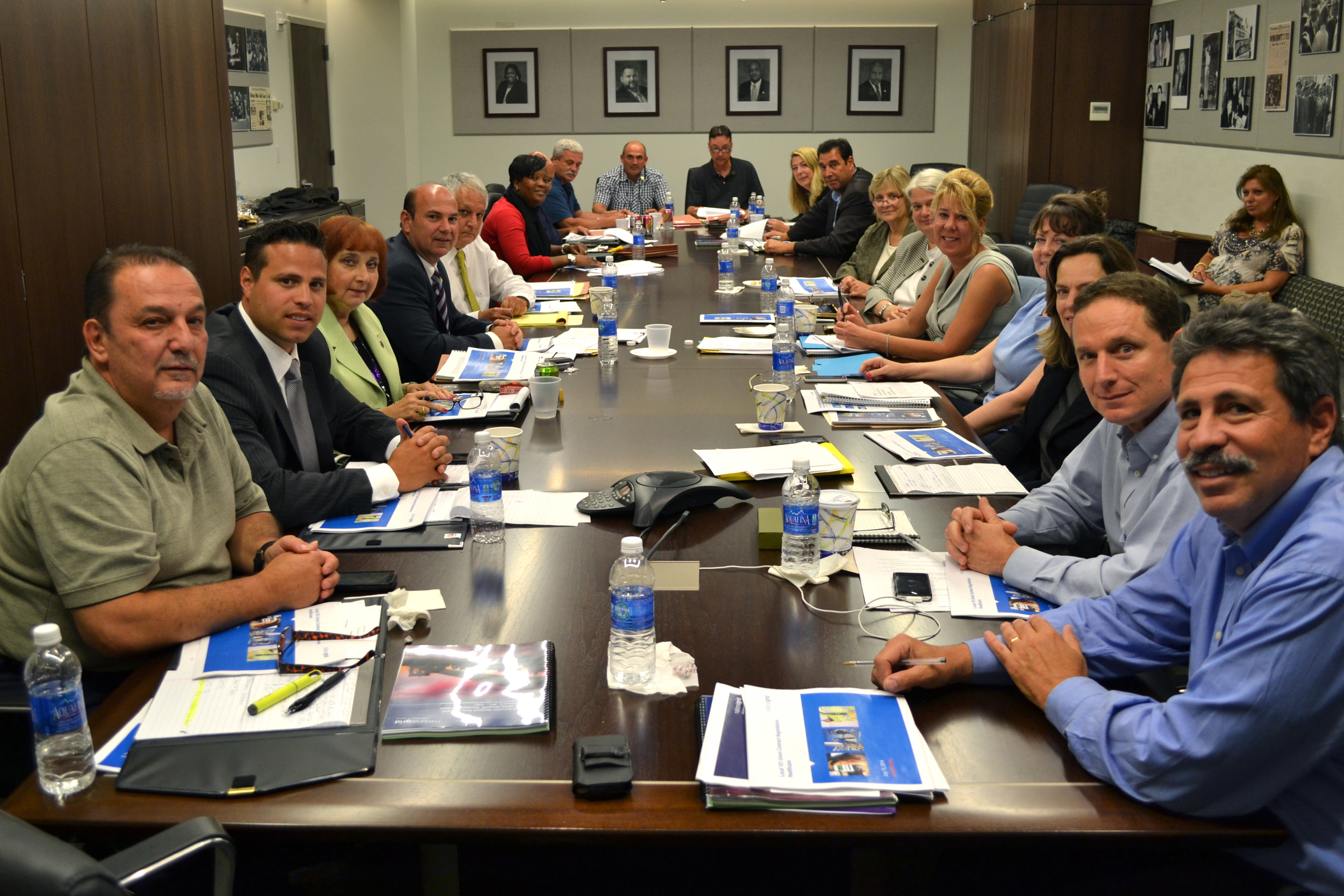 The Local 101 negotiating team (at left) sits opposite management at the Local 101 union hall, in the opening meeting of 2014 contract negotiations.