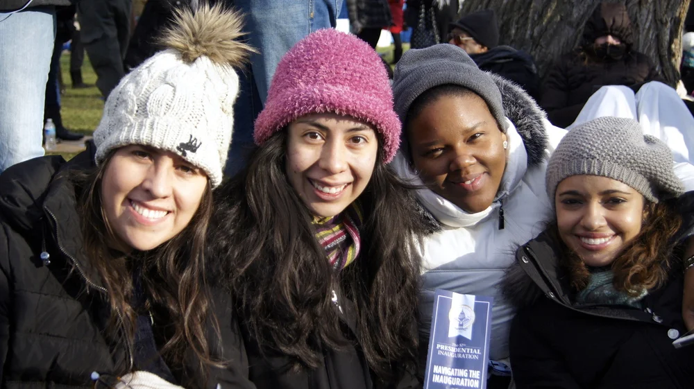 Four Lynn University and WII students wait in the January cold on the National Mall's lawn for Obama's second inaugural address. 
