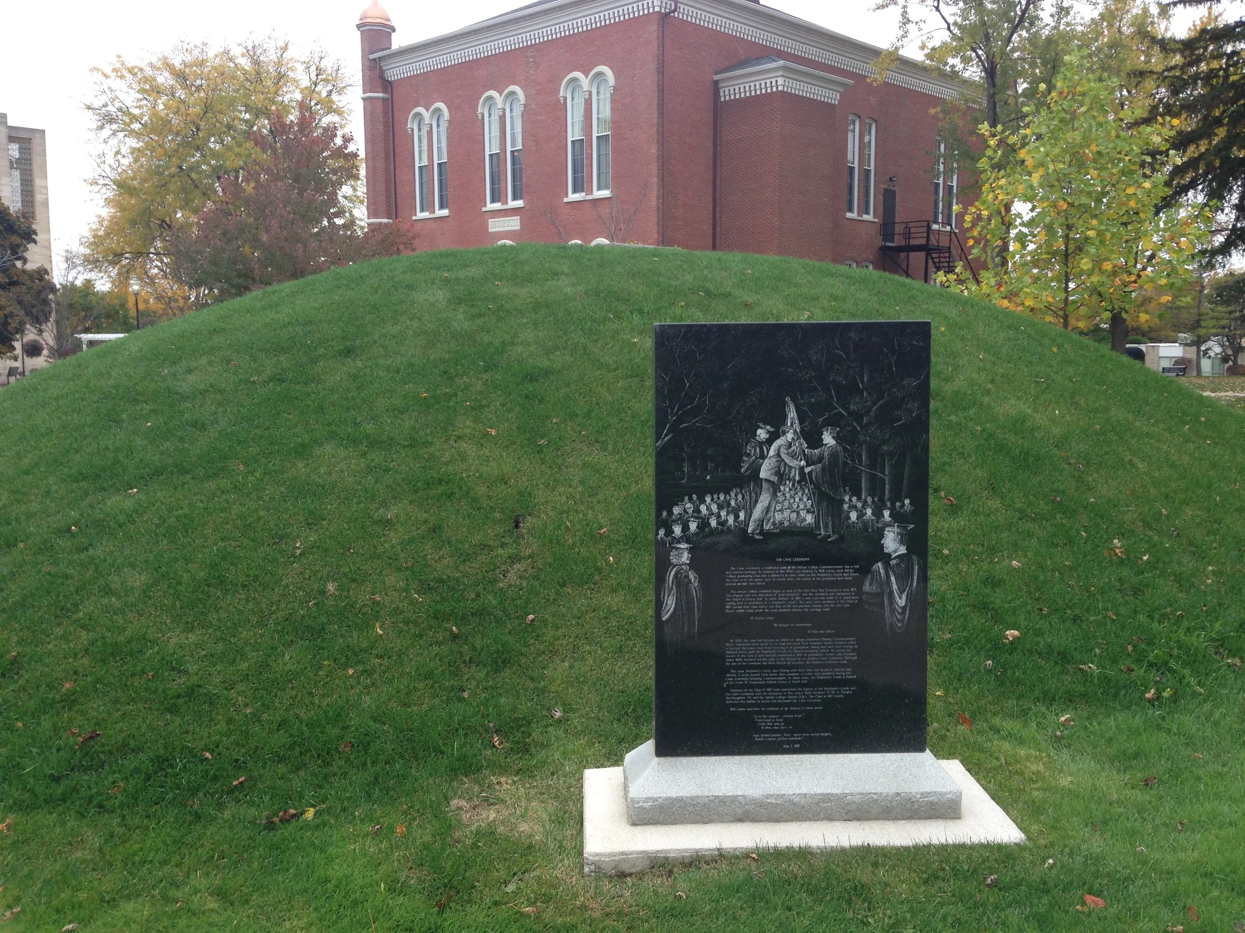 I love quirky campus features, and this mound definitely qualifies. The plaque describes a tradition at Adrian where students from graduating classes add ribbons to a pole that is then handed down to the next class at this site. It's apparently been going on for a very long time. I'd like to see that.
