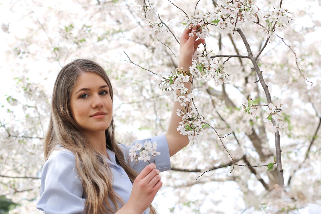 Monica taking in the cherry blossoms, a novelty of spring in DC.