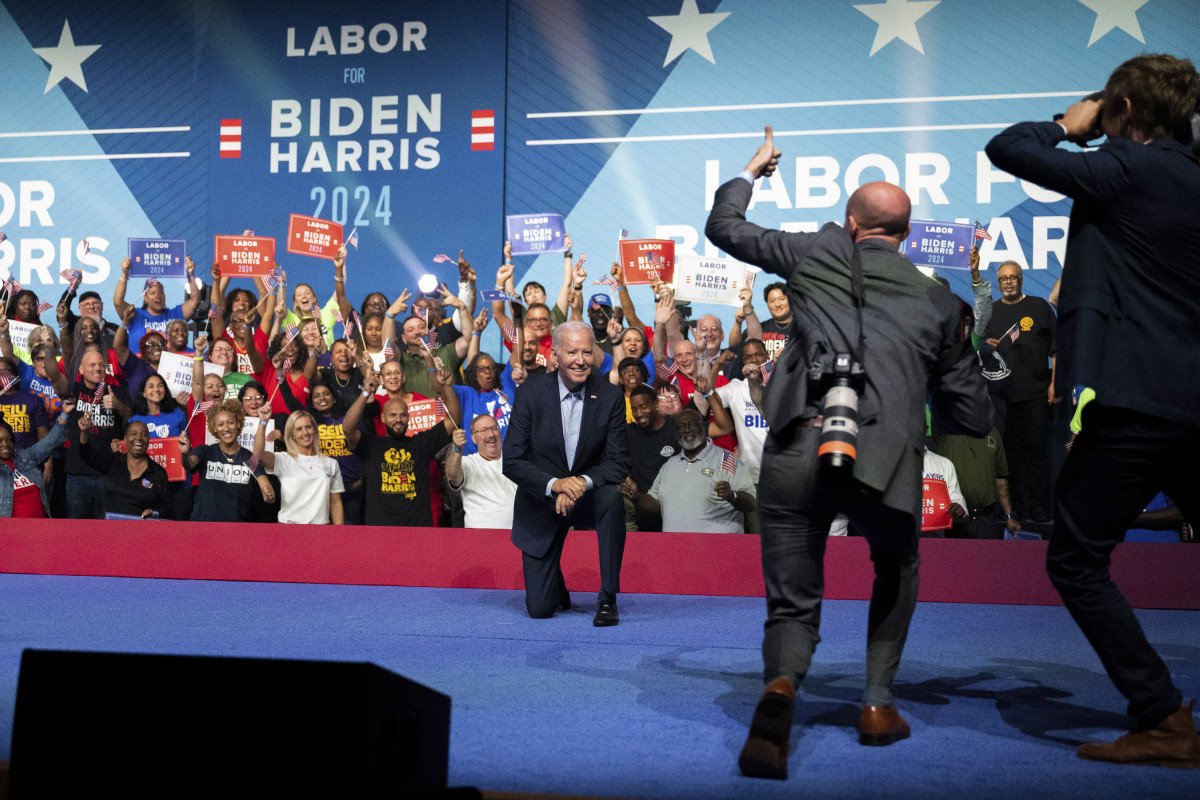 President Joe Biden poses on stage during a political rally at the Philadelphia Convention Center in Philadelphia, June 17, 2023 (Eric Elofson photographing in foreground) (1).jpg