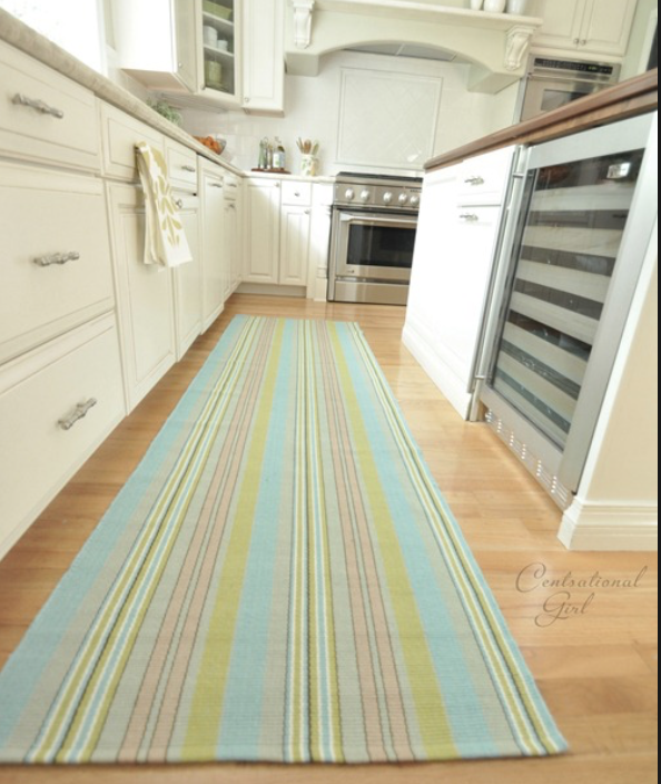 This runner adds color and style to a pretty plain kitchen. I love Dash &amp; Albert rugs; they are indoor/outdoor, so perfect for high traffic areas. And they come in hundreds of patterns and color ways. I have one in my bathroom and it's easy to t…