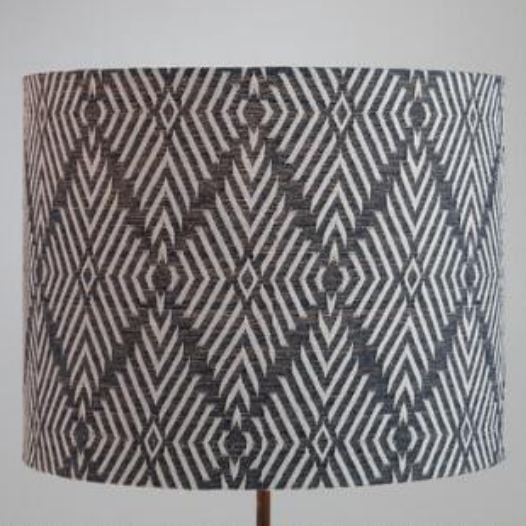 World Market lampshade adds a trendy bit of tribal vibe. Great for a den or desk lamp.