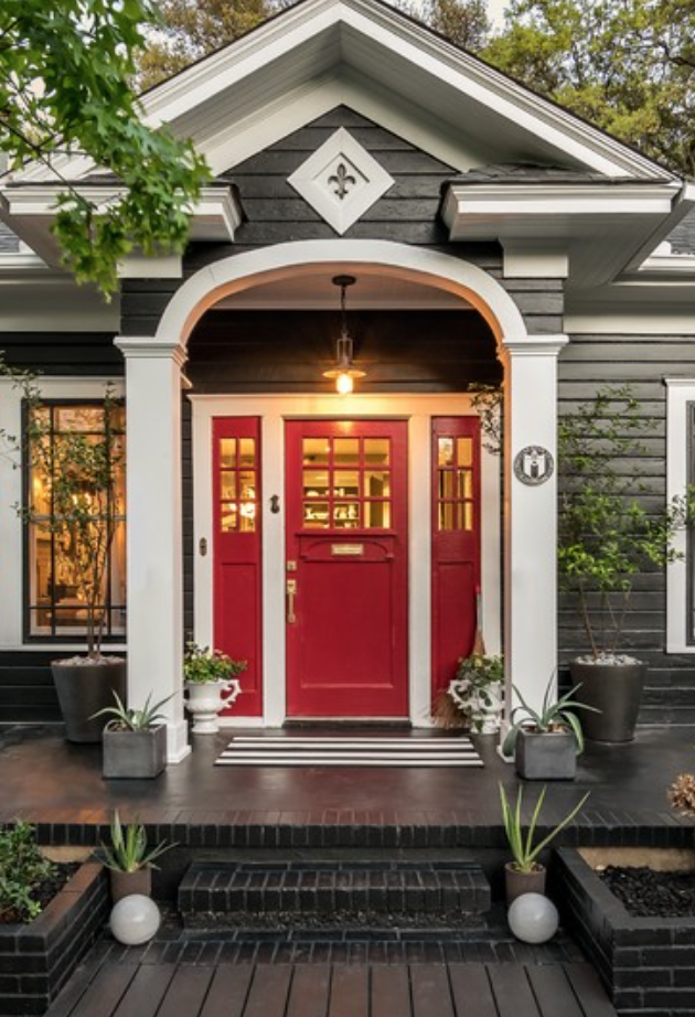 I happen to be the owner of a RED front door, so this is right up my alley. The dark brown accents really make this a WOW entrance. Not to mention the creamy white trim and the potted plants. CALIENTE by Benjamin Moore is a great red option. 