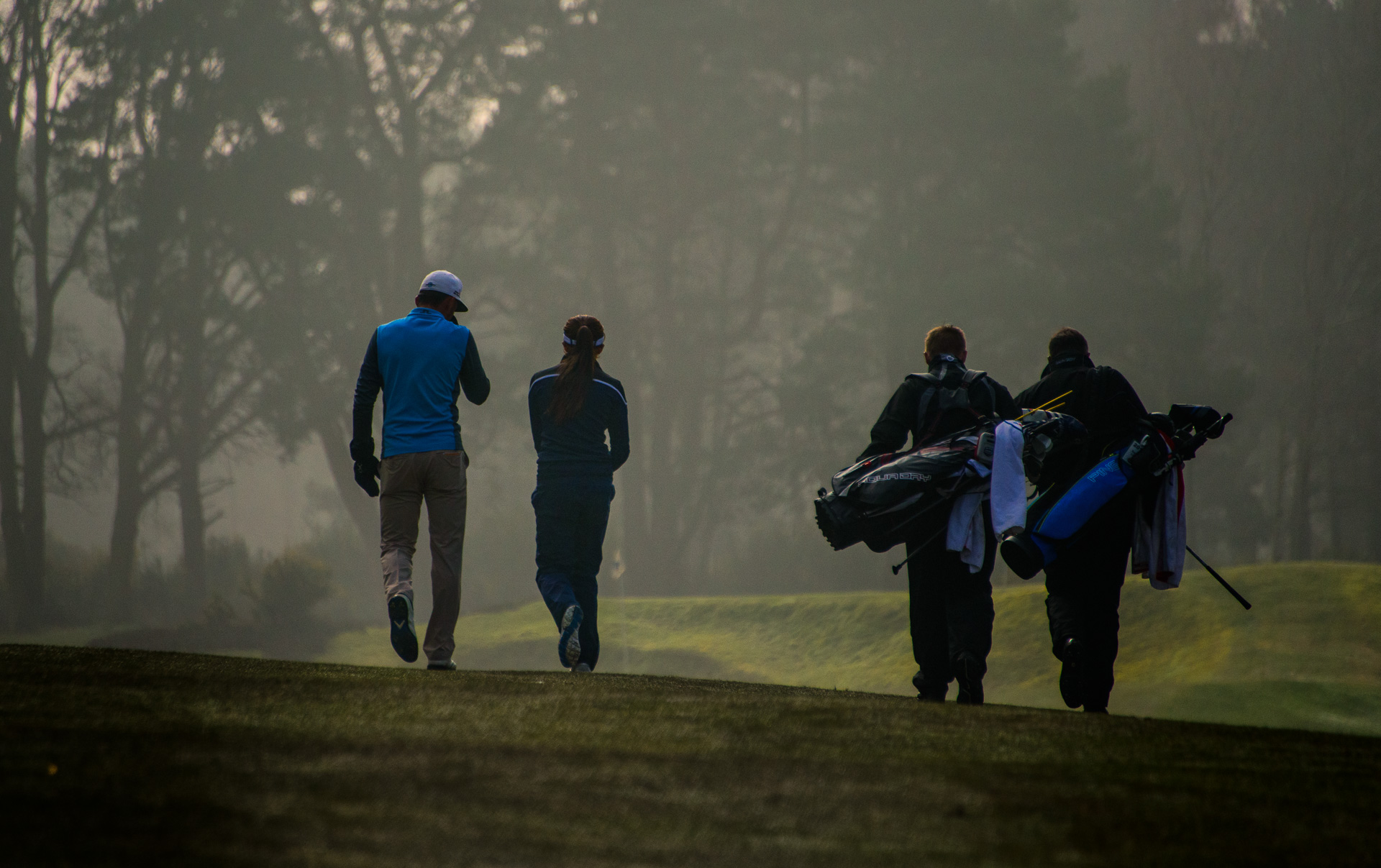 Winning team and caddies in sync