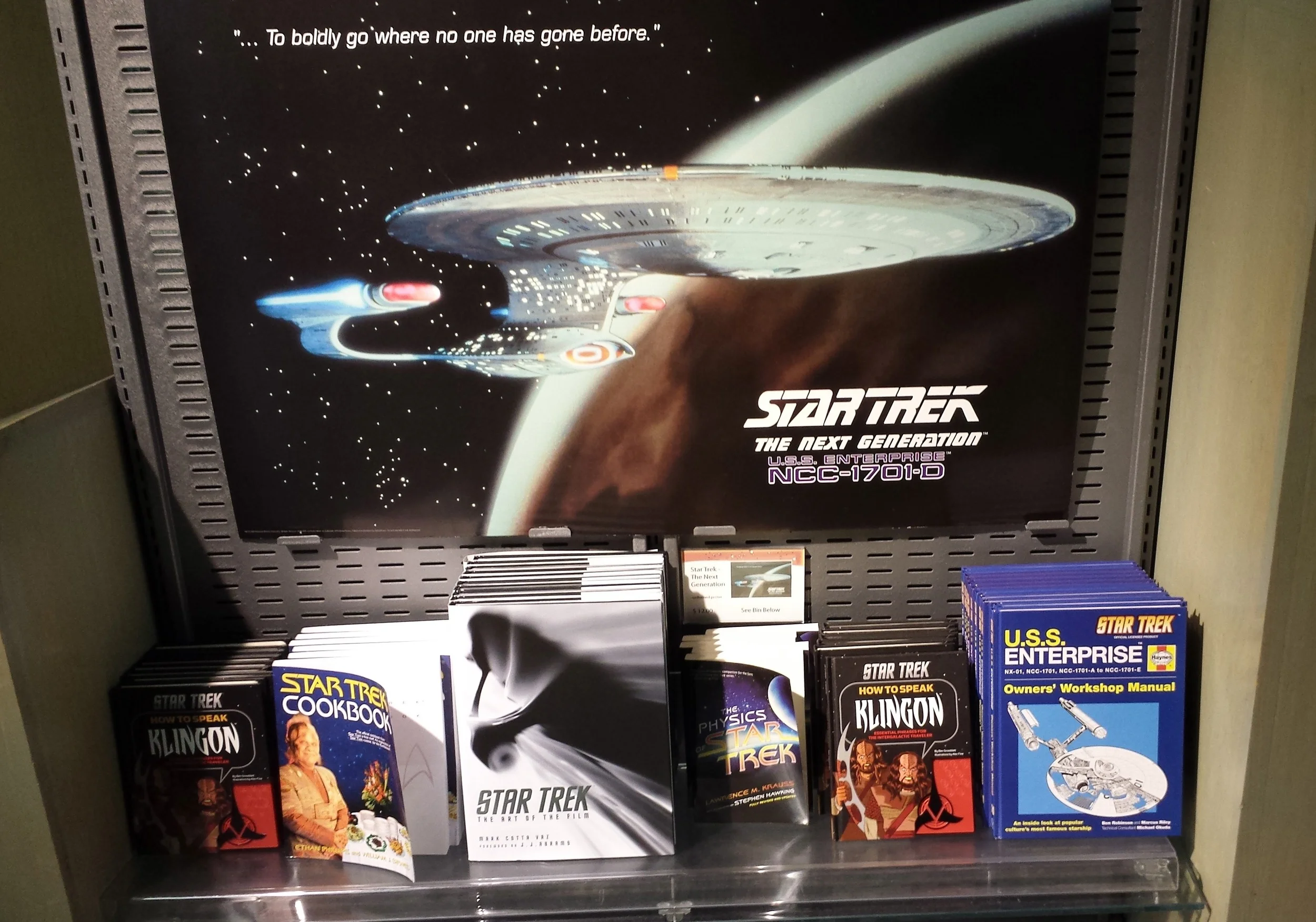 The Enterprise is surrounded by Star Trek merch.