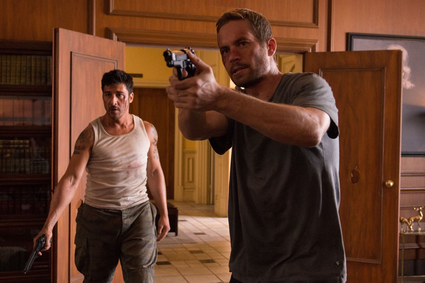 David Belle and Paul Walker in Brick Mansions, a not-as-good remake of the French action film District B13.