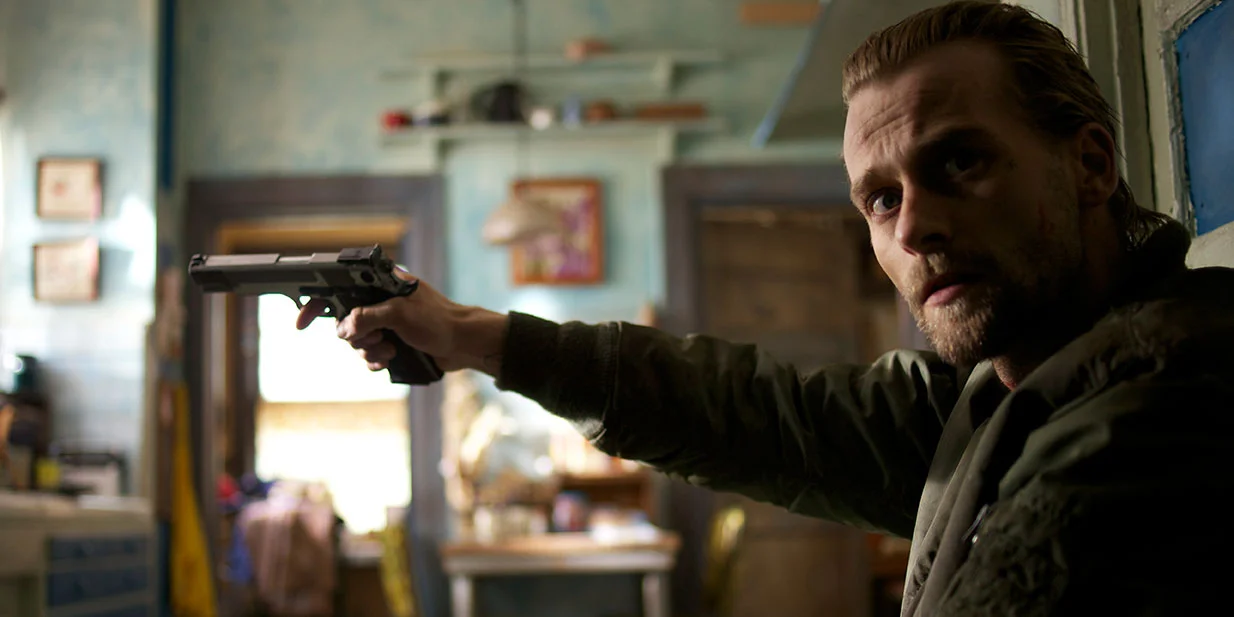It's a cruel irony that Joe Anderson's performance as an Aryan Nation asshole who takes a black family hostage is the best thing about the grim, dim Supremacy .