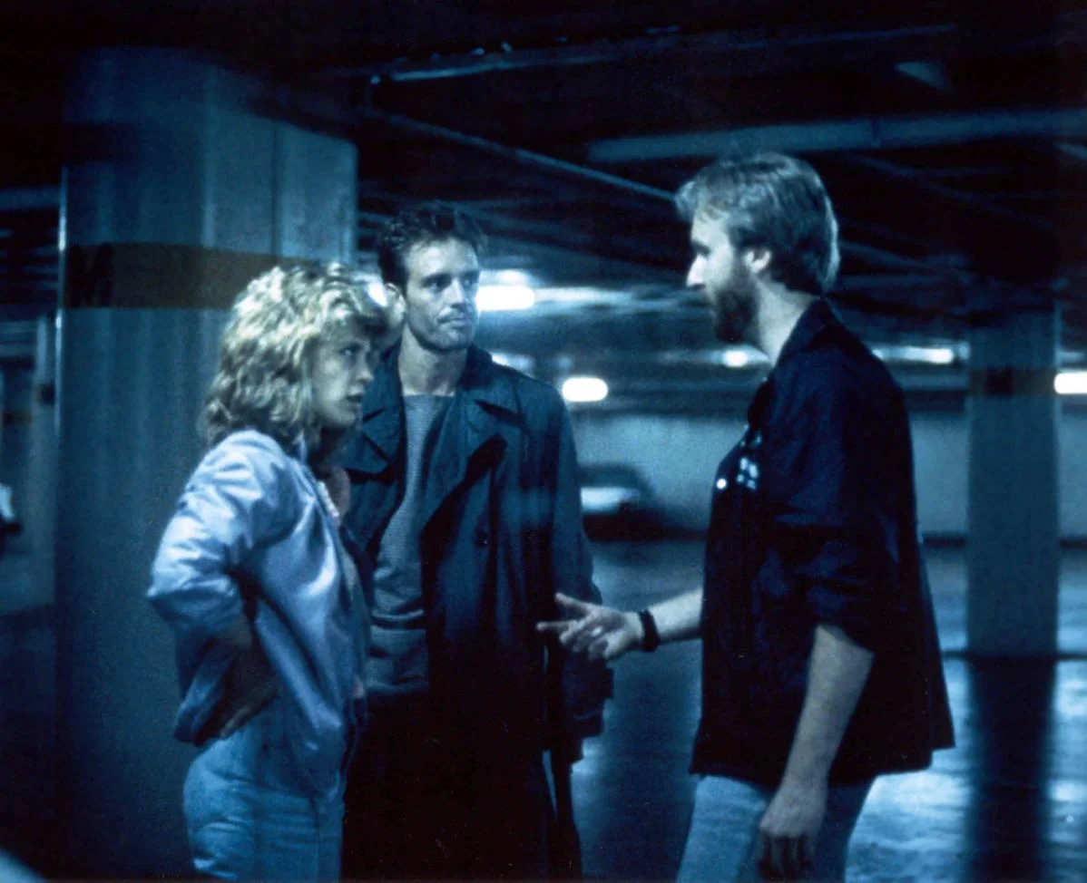 Linda Hamilton and Michael Biehn on the set of The Terminator with writer-director James Cameron.