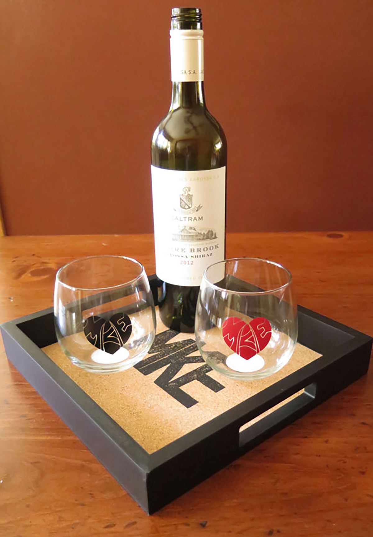 MKE cork serving tray $50, MKE love glasses $12