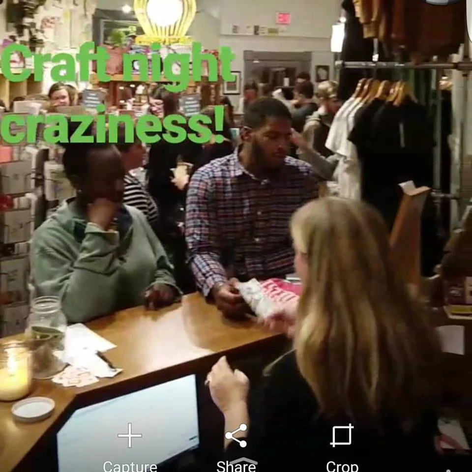 A couple of guests buying some Orchard Street Press apparel.