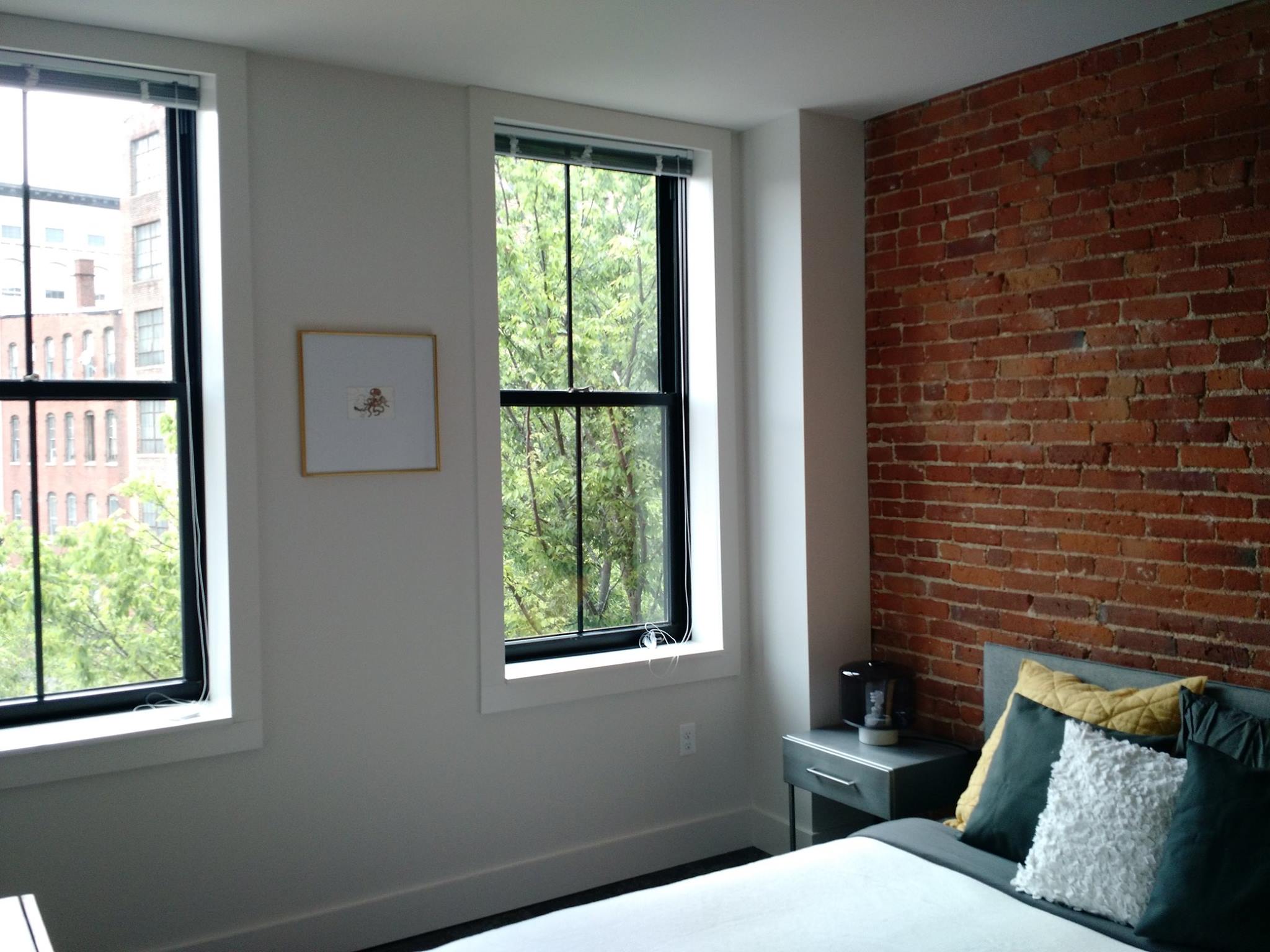 Exposed brick and beam, tall ceilings, create amazing living spaces at JM Lofts.&nbsp;
