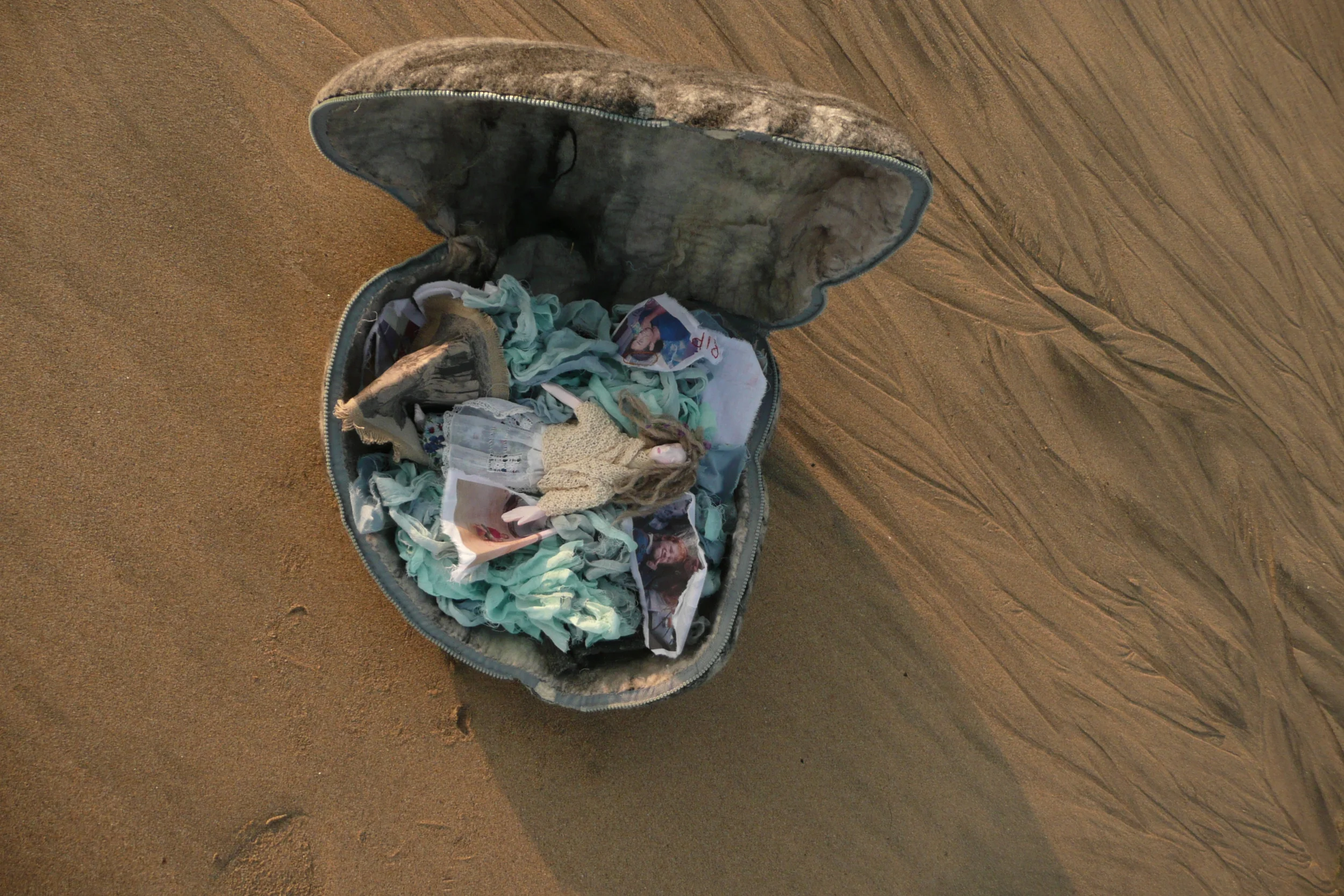 Doll in pebble; Claire Blackburn