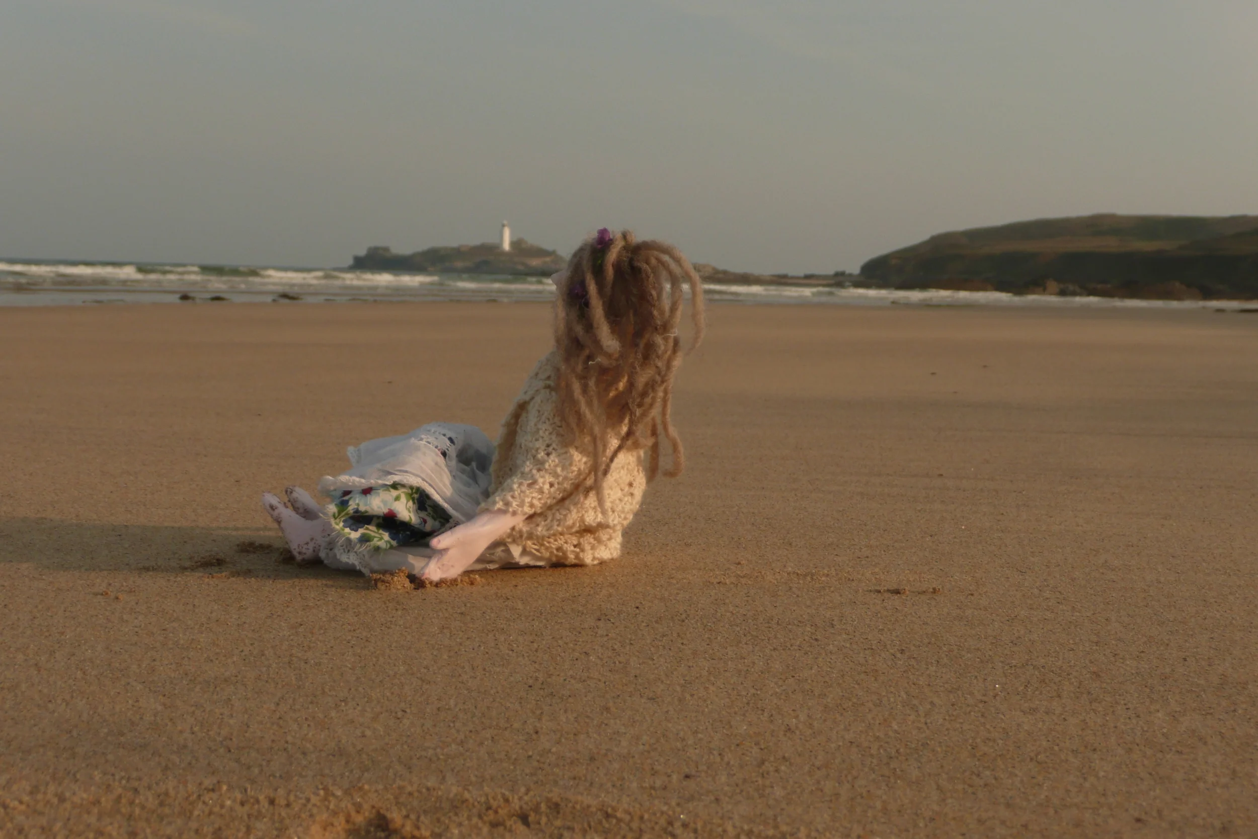 Doll on beach; Claire Blackburn