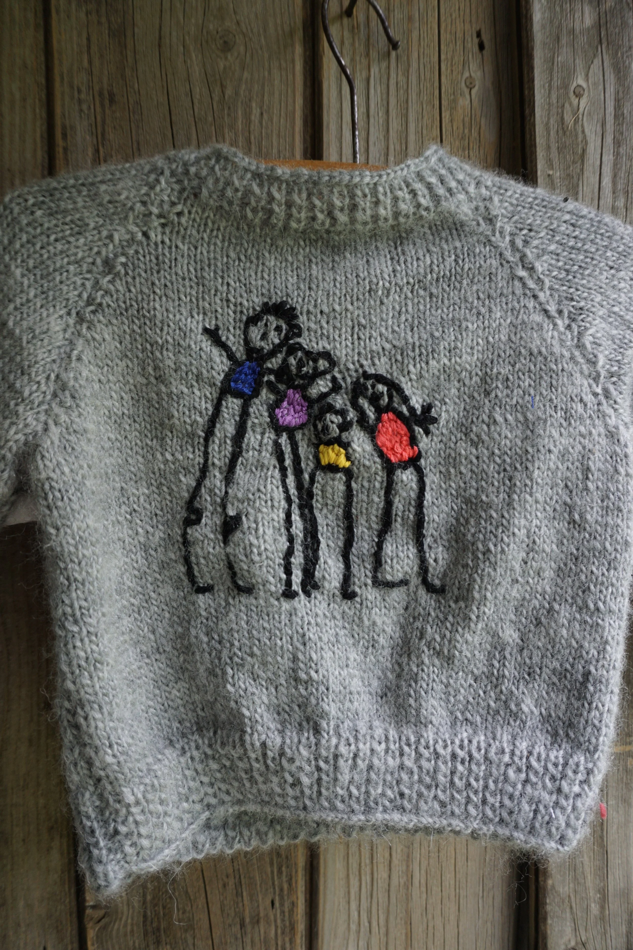 Family Value by Claire Blackburn; babies jumper (back)