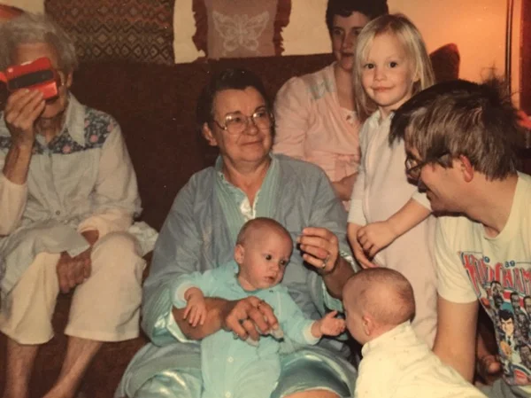 This photo is so precious for a couple of reasons: This photo was taken towards the end of 1990, my brothers' birth year. They were born prematurely and had respiratory problems as a result. Obviously, they've pulled through but not with ease. But you'd never guess that looking at this photo. When I was born, I had 5 living great grandmothers. One of them, far left, clearly maintained a sense of humor despite Alzheimer's. No one in the picture caught her goofing off, but my grandpa behind the camera did. My dad's hair. The one constant in my life is that no matter what, I can rely on my dad's hair looking like that in the morning and mine nearly matching it. At least I know where I get it from (Also, please note my father's shirt. Word up to "World Champs, the Pistons: 1989") My brother looking as if he's philosophizing about something while unable to speak. Everyone in PJs. And then there's my grandma. My grandma's engagement talking to my dad out of frame. She's still the focal point of the photo despite everything else going on. Being right smack in the middle of everything. She does that.