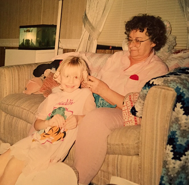 This is my grandma. Putting my hair in rollers and me cheesing while wearing (of course) my favorite Aladdin night gown. Pictured in back (per most photographs between the ages of 1-10) is my beloved Mickey Mouse. I don't think there's much of a story here outside of the fact that I probably wanted my hair curled because grandma did her own, and more than likely, those curls fell flat about 20 minutes later. 