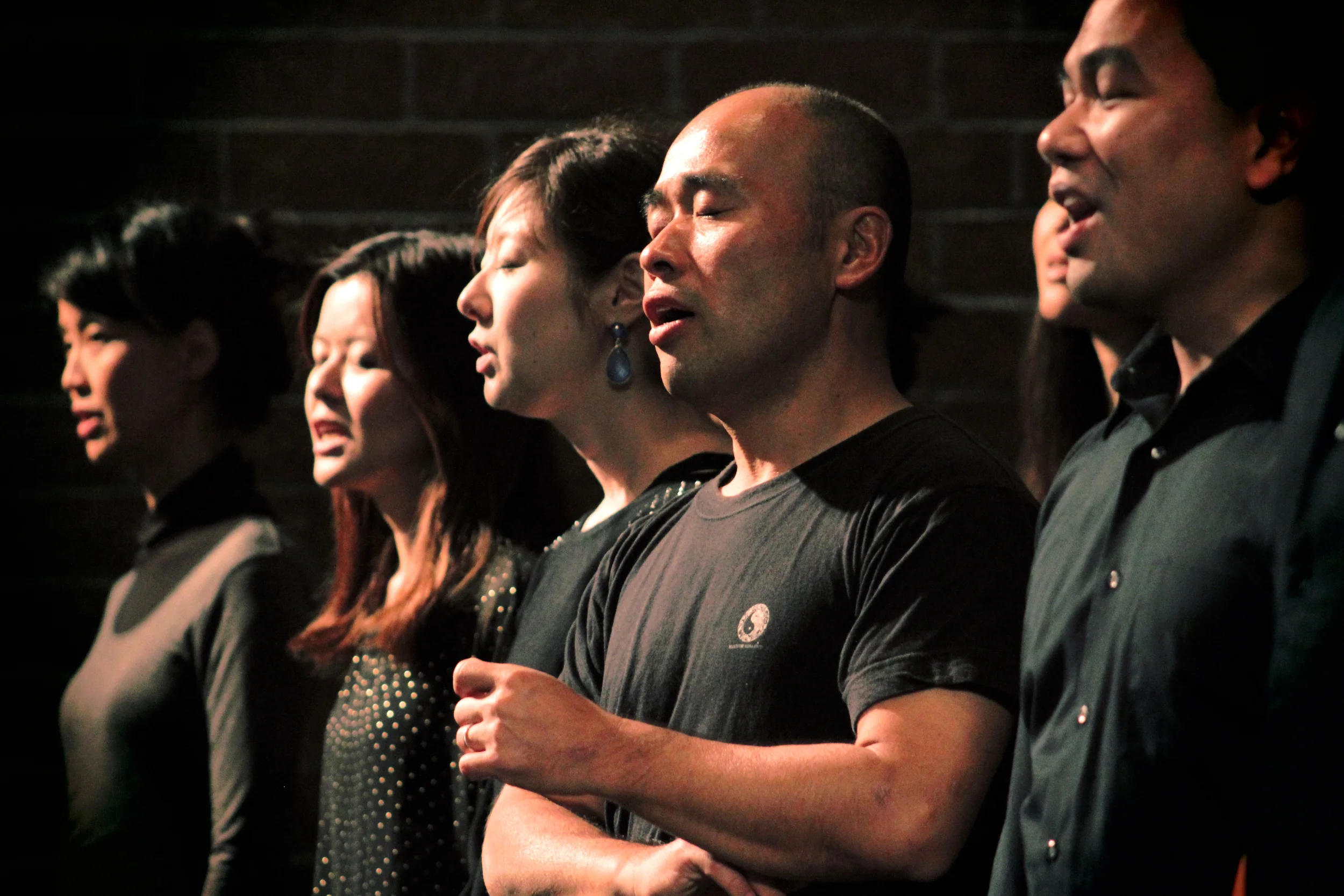 A choir performs an evening concert for a church in Long Beach.