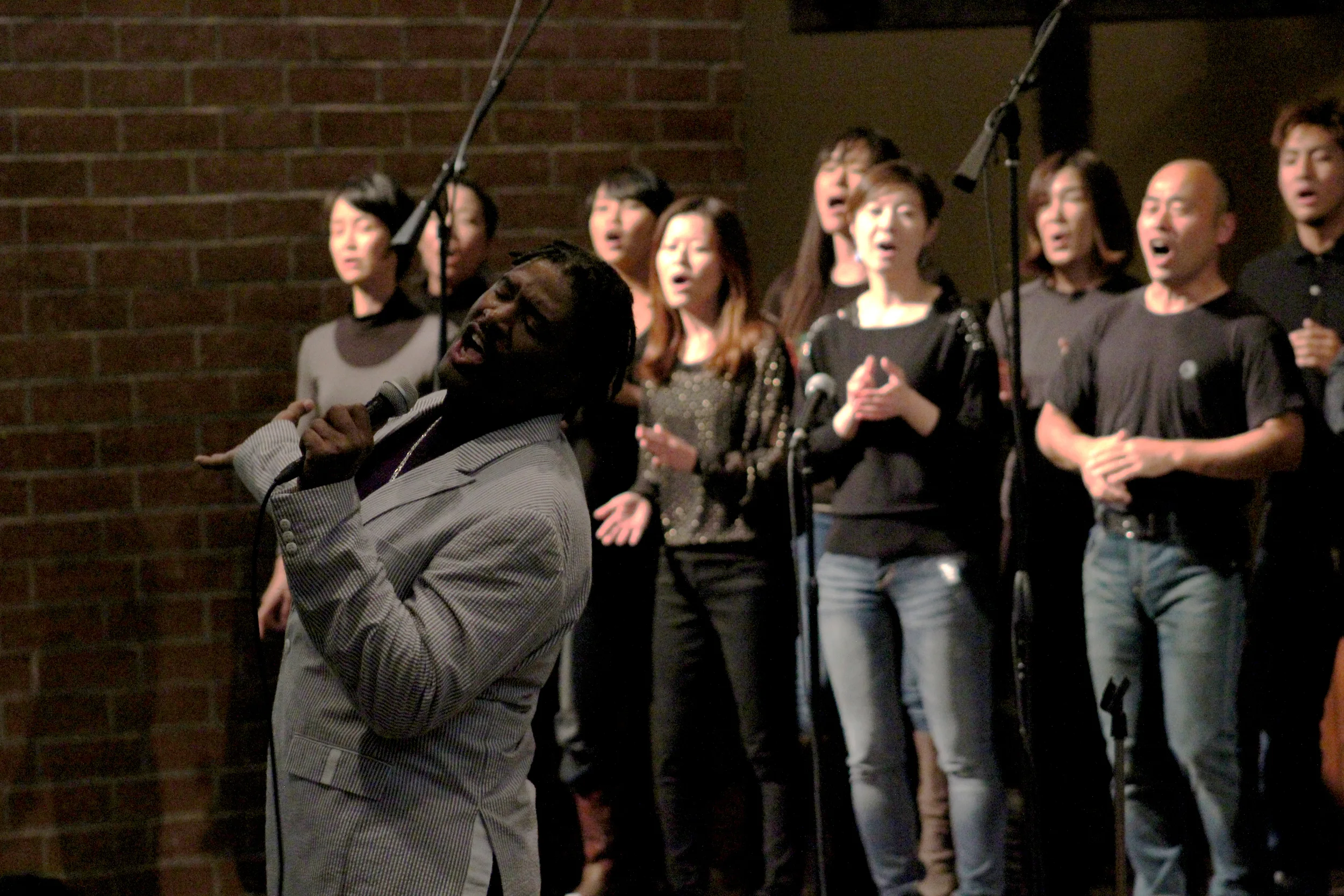 Sidney leads one of his choirs as they sing a Japanese gospel song - "Kimi Wa Aisareru Tame Umareta."