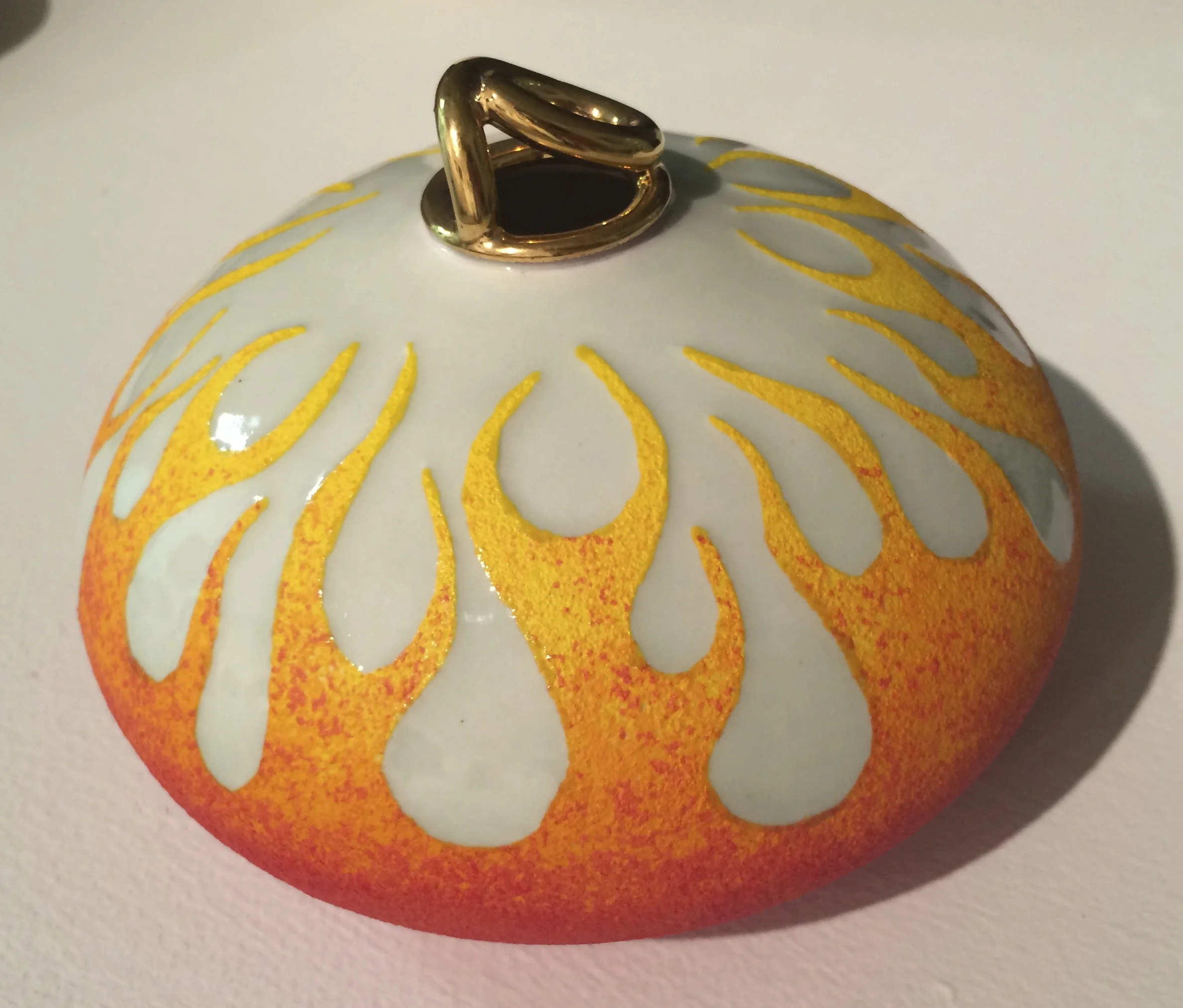 Scott's newest piece. He's been working on perfecting his glaze combinations with the flame theme for a while, and he's finally satisfied with the results. And when he takes photos of it with his perfectionist set-up, I'll post again to show the difference photography makes. 