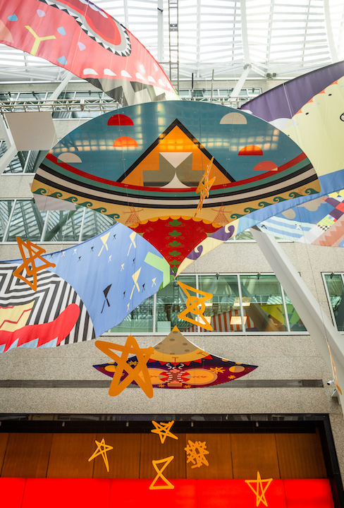   Tepkik, 2018    Materials:  Print on Polysilk, 3M reflective print on Aluminum panels  Dimensions:  100'x40'x25’  Photo:  Ernesto Di Stefano  Installation commissioned by Brookfield Place Toronto.  Produced by Pearl Wagner Art Consultants.  Project