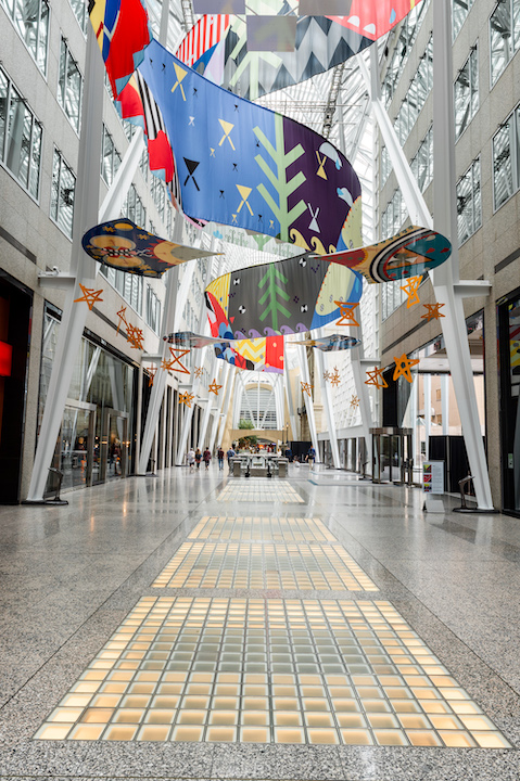   Tepkik, 2018    Materials:  Print on Polysilk, 3M reflective print on Aluminum panels  Dimensions:  100'x40'x25’  Photo:  Ernesto Di Stefano  Installation commissioned by Brookfield Place Toronto.  Produced by Pearl Wagner Art Consultants.   Projec