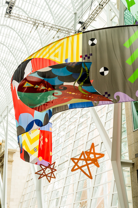   Tepkik, 2018    Materials:  Print on Polysilk, 3M reflective print on Aluminum panels  Dimensions:  100'x40'x25’  Photo:  Ernesto Di Stefano  Installation commissioned by Brookfield Place Toronto.  Produced by Pearl Wagner Art Consultants.  Project