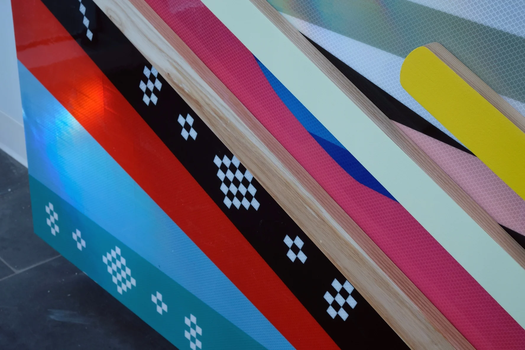Pjila'si, 2019 Zatzman Sportsplex , Dartmouth Materials: Oak, walnut, maple, Labradorite, steel, acrylic paint, ash, plexiglass, 3M reflective print on Aluminum panels Dimensions: 35’x10’x2’ Photo: Chantal Routhier Installation commissioned by City of Halifax Regional Municipality Project managed by IOTA STUDIOS