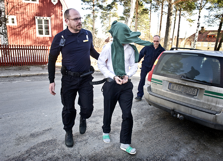 Murderer brought into the courtroom during a windy day in Hudiksvall, Sweden. 
