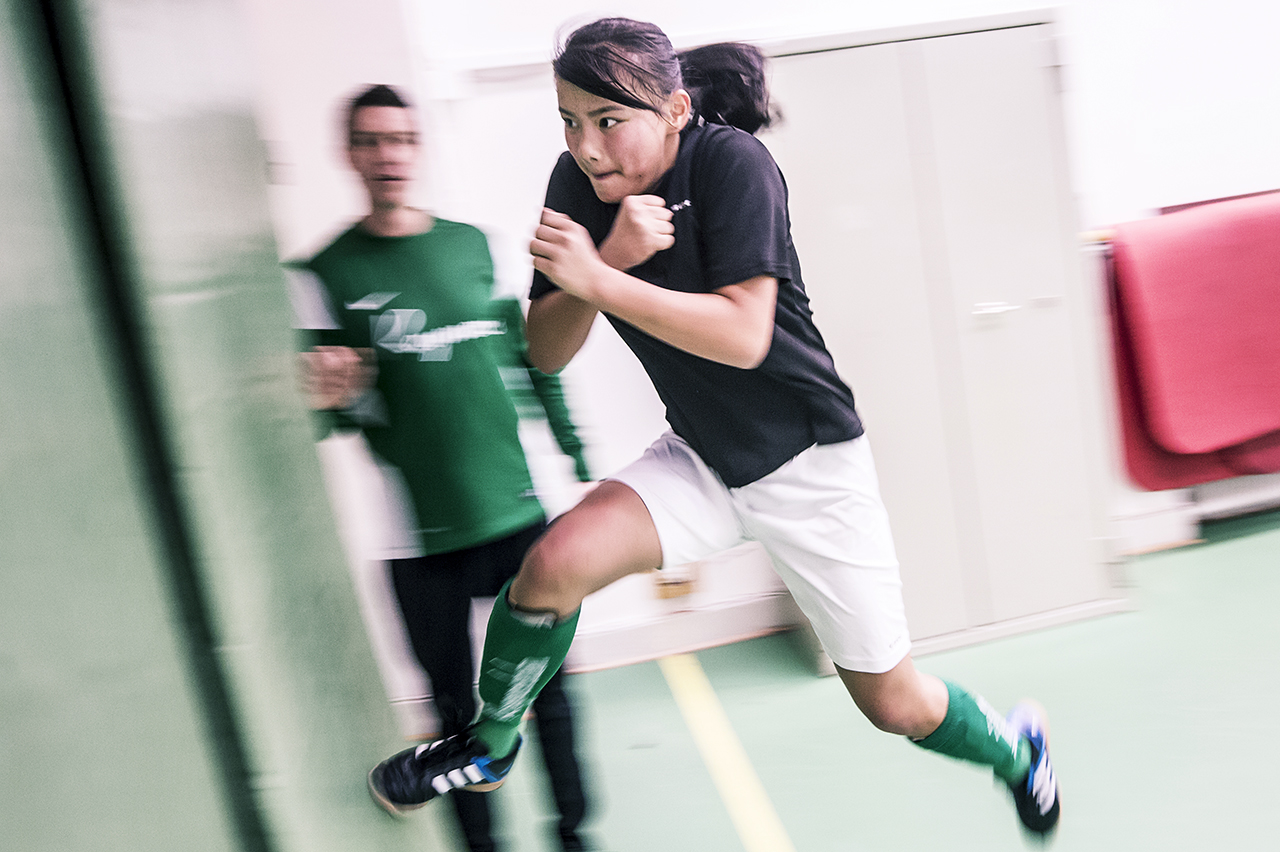Physical exercise in a sports hall during winter.