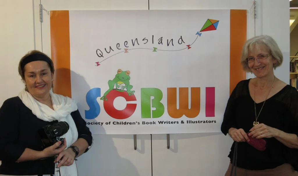 Our new outdoor/indoor banner with its designer, Lynn Priestley.