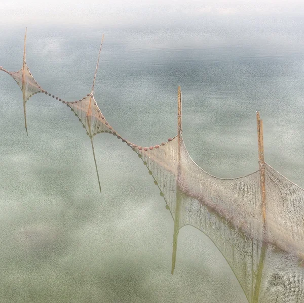 Fish Nets at Monte Argentario. ©2015 Lee Anne White. Shot with iPhone. Monte Argentario is an island in the southernmost part of Tuscany between Rome and Grosseto. With a bit of time to kill on our way back to the airport, Alan and I made a spur-of-the-moment decision to drive out to the island for lunch. It ended up being one of my favorite stops on the trip. As we were driving across the bridge on our way back to the mainland, I noticed these nets out in the water and asked Alan to pull over. The water was still, and afforded beautiful reflections of the many clouds in the sky that day.