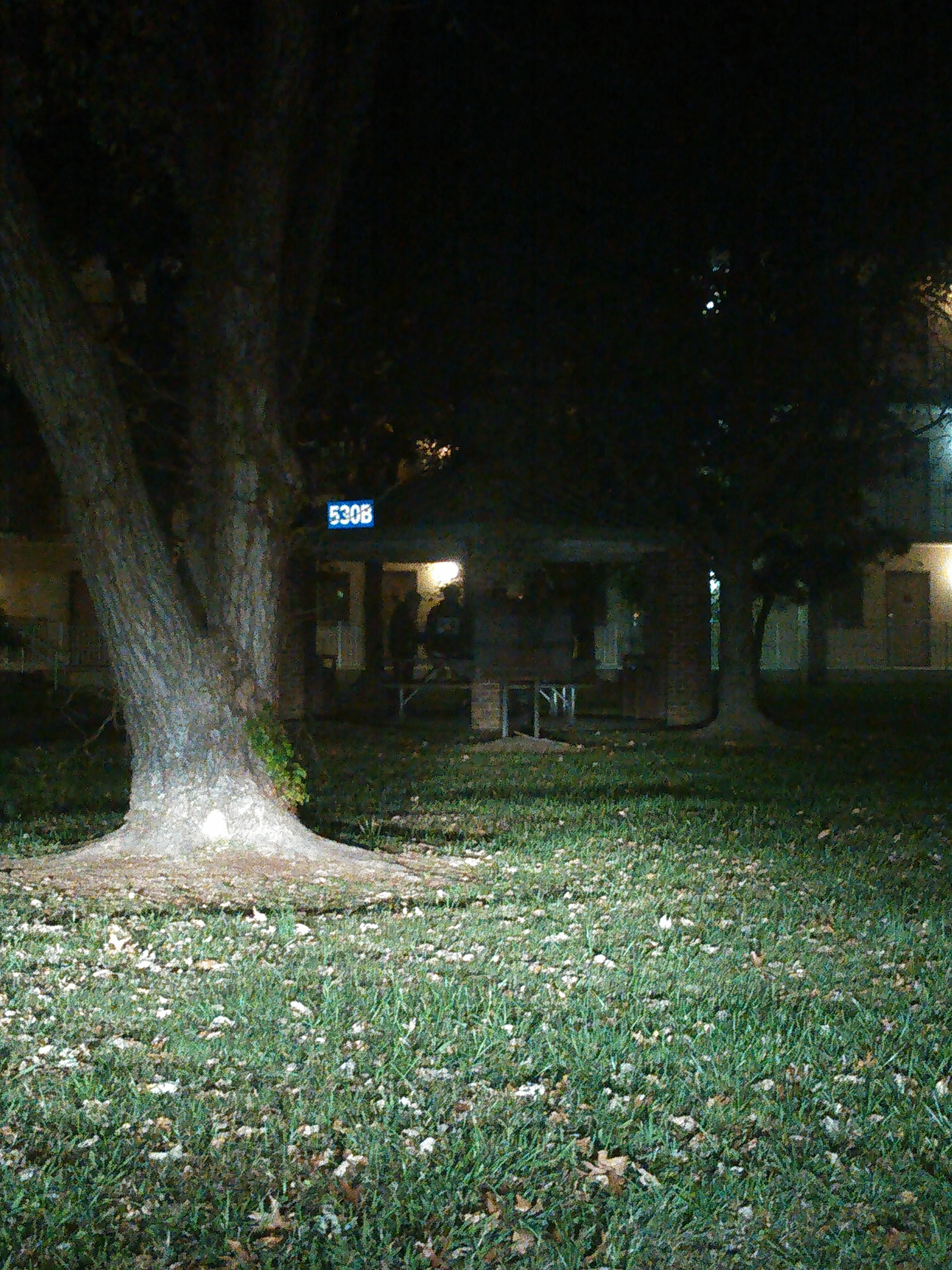 Our brother, Ramon, witnessing to two sailors in front of their barracks.