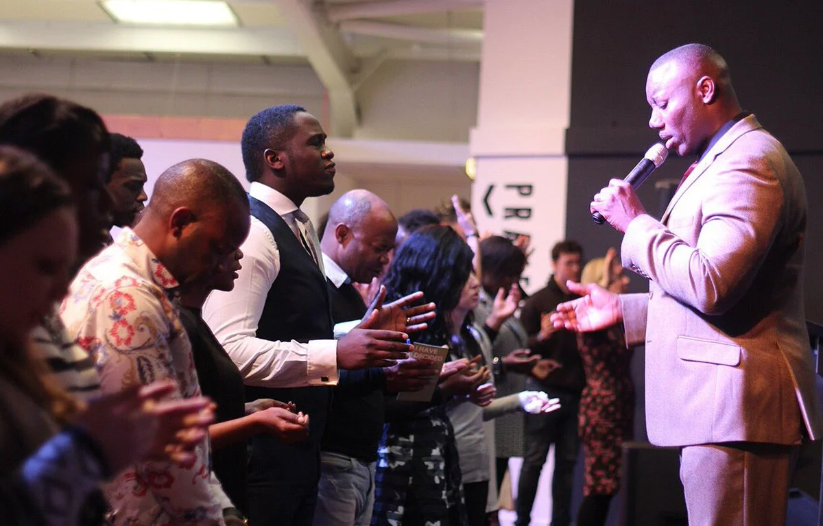 Pastor Ajala ministers at the altar