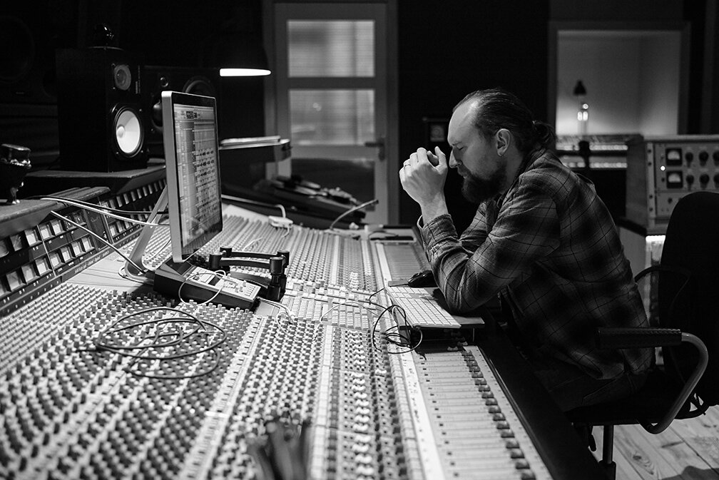 Man at music mixing desk