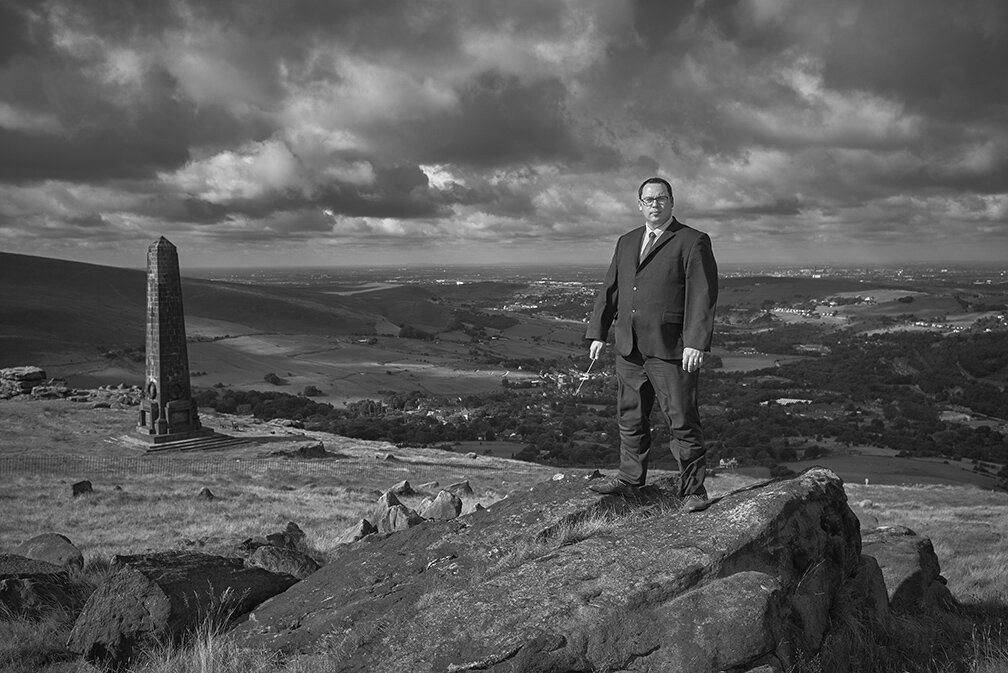 Portrait of man on a hill