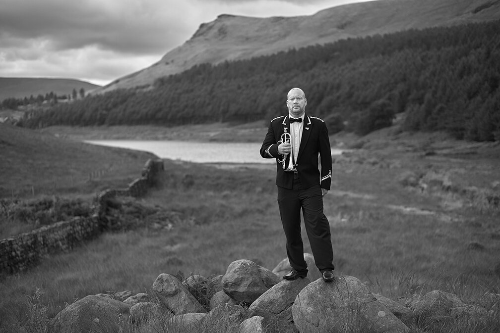 Brass band musician in landscape