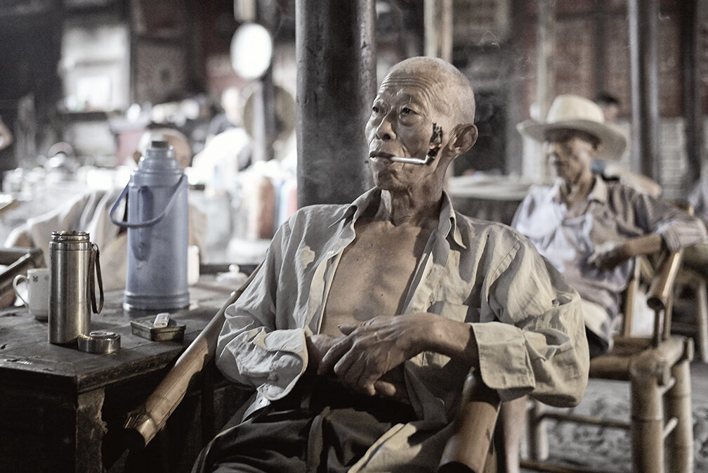 Chinese man smoking pipe