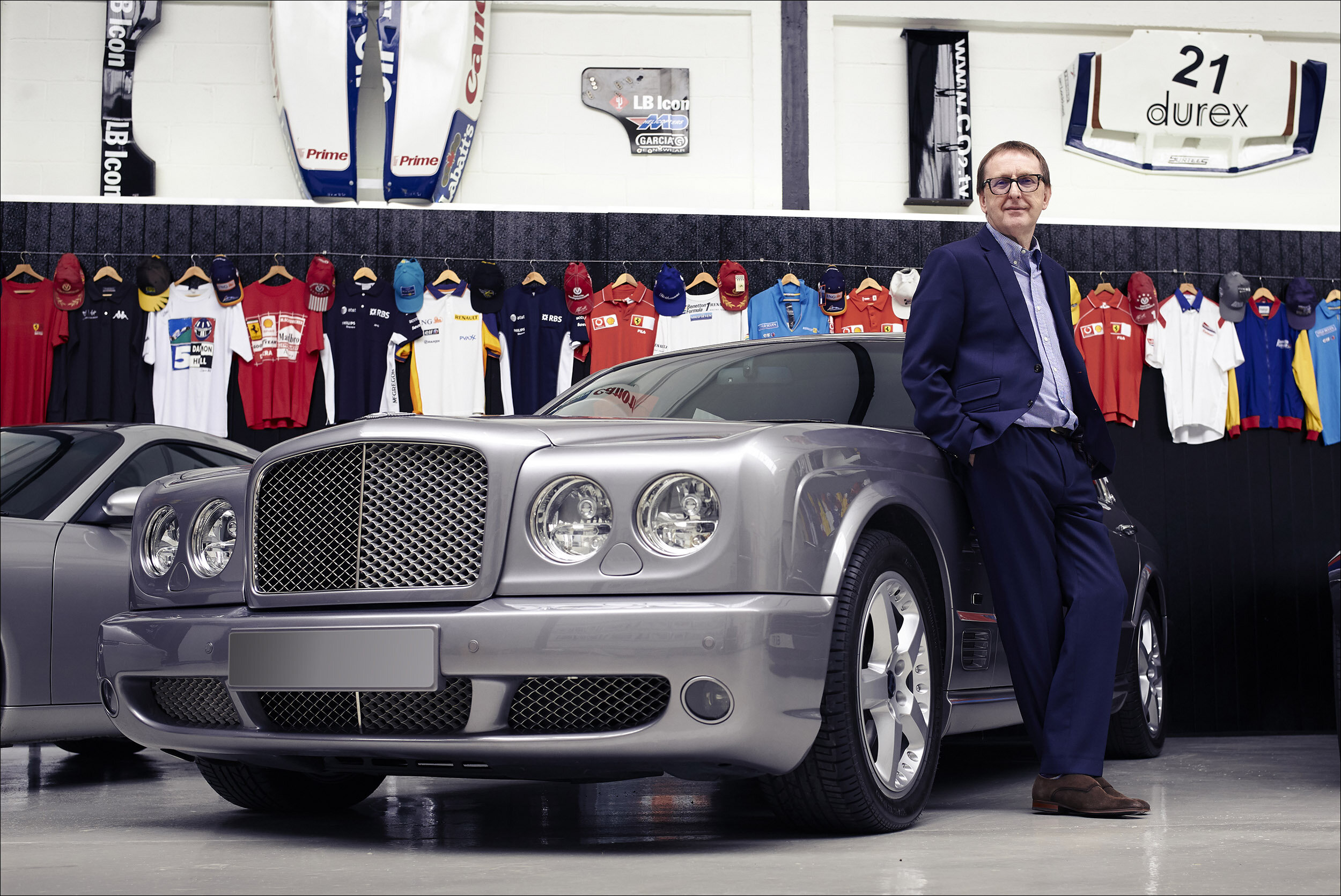 Portrait of man with Bentley car