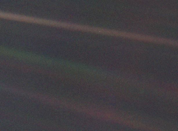 This image of Earth is one of 60 frames taken by the Voyager 1 spacecraft on February 14, 1990 from a distance of more than 6 billion kilometers. In the image the Earth is a mere point of light, a crescent only 0.12 pixel in size. Our planet was caught in the center of one of the scattered light rays resulting from taking the image so close to the Sun. 