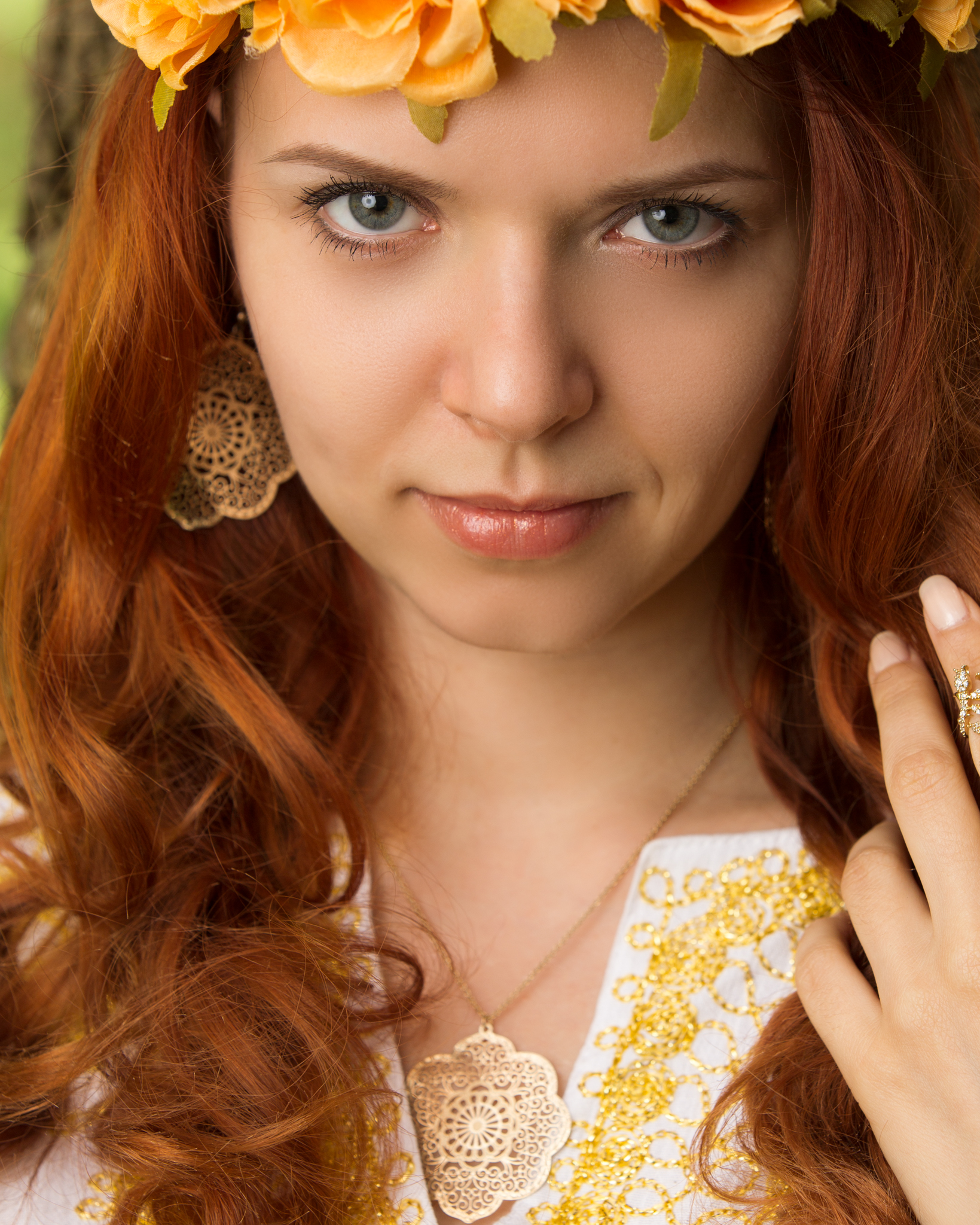 Dancer Iana Komarnytska, wearing a pair of earrings and necklace from Lavishy, a part of the Blue Dot Collection.