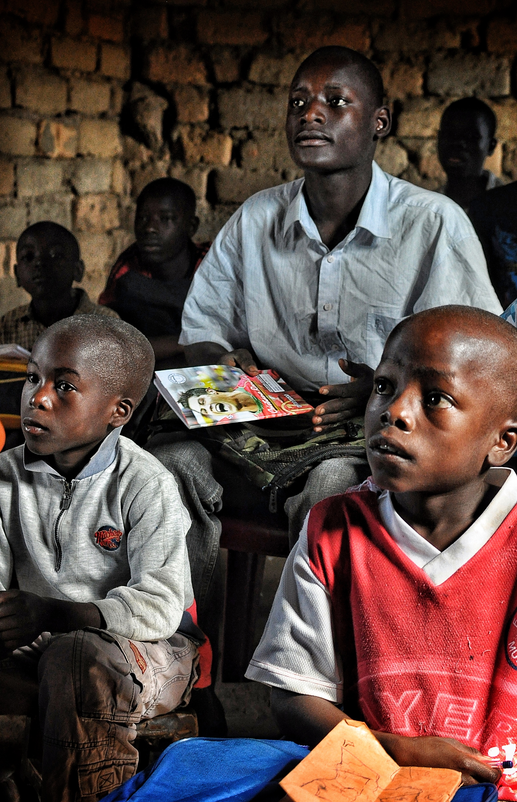 Students of different ages mixed together in a classroom in Luanda, Angola.